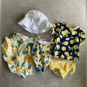 Three 3-6 month girl bathing suits and hat